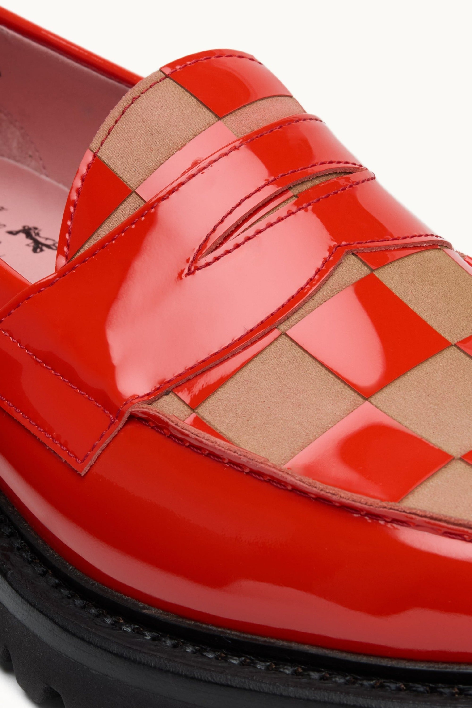 Laser-etched checkerboard vamp detail